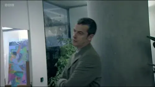 Screenshot: At a press conference,
a bunch of press people appear,