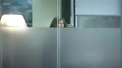 Screenshot: I think she's on the phone.