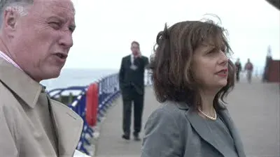 Screenshot: Is that her? Oh, no, two blokes. Are you sure you don't want one?