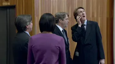 Screenshot: Emma, we've got a woman staring at us from a balcony.