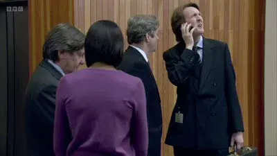 Screenshot: Dark hair, like in a bob, looks like she's in her own world and has got lost there.