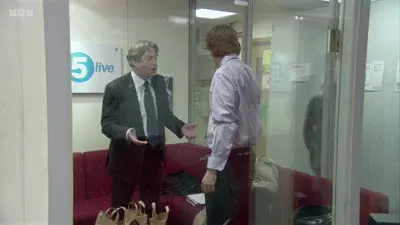 Screenshot: Is the vicar about to come round with Robin Askwith?