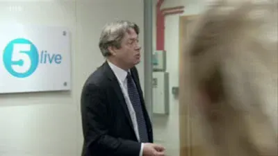 Screenshot: Headphones on ears, arses on chairs.