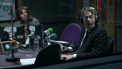 Screenshot: And, as we speak, who should come rolling along the corridor