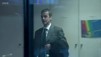 Screenshot: Peter Mannion, can you explain, please, why your party spin doctor has arrived entirely unannounced?