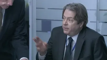 Screenshot: Phil has a staff cuts dossier with maps and charts and everything.