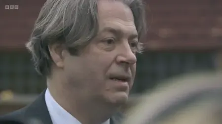 Screenshot: Drinking on the job, Minister? It...It's a...a half bottle.