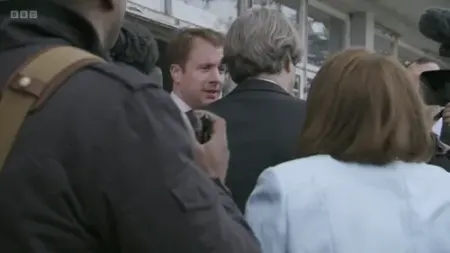 Screenshot: to stand next to this man.