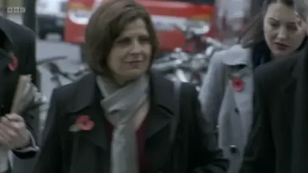 Screenshot: Why did we have to stand there smiling like that?